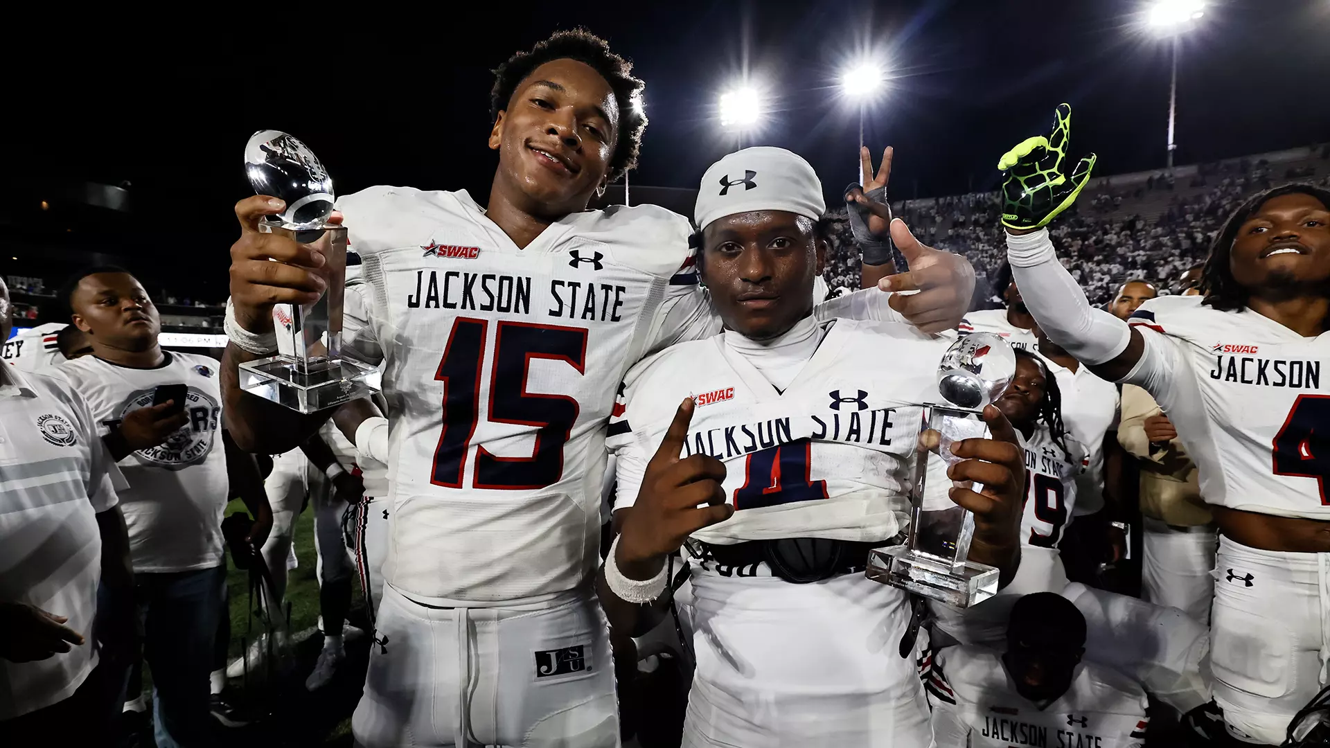 Jackson State football players celebrate with trophies after defeating Tennessee State in the 2026 John Merritt Classic