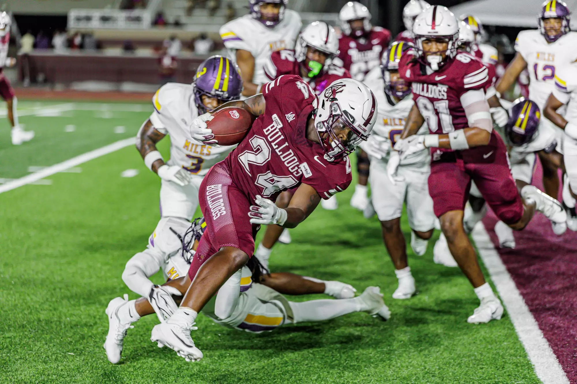 Alabama A&M running back Troy Bruce carries the ball against Miles in Week 1